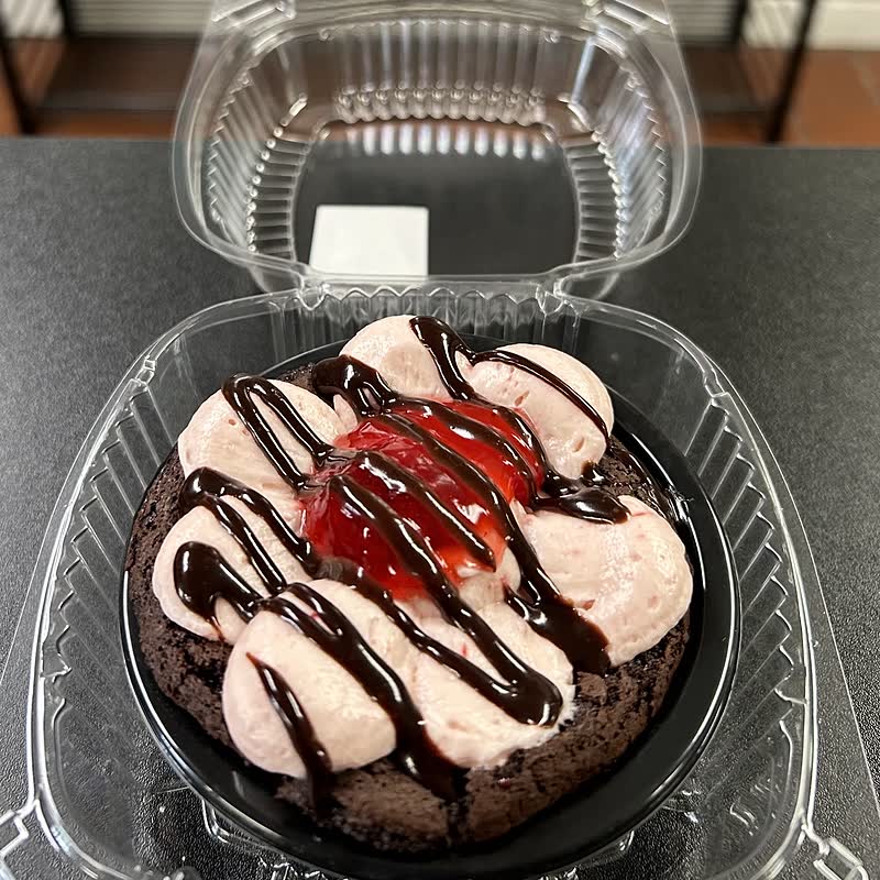 A gluten-free chocolate cream pie piped with strawberry buttercream