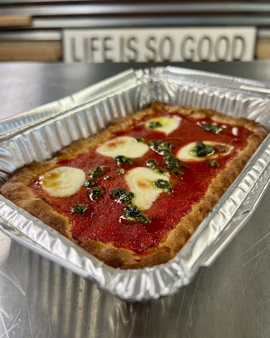 A gluten-free upside-down margherita pizza on the counter at Bleu Bear Bakery